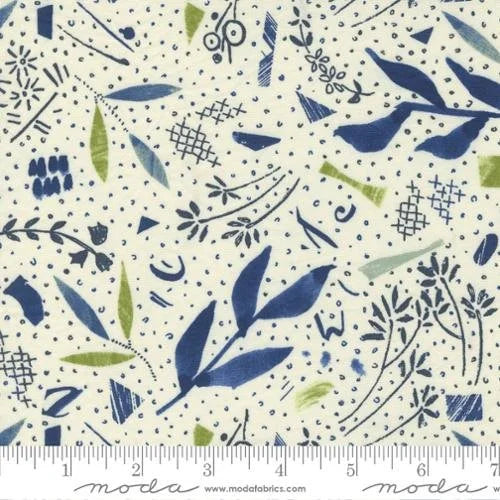 Collage quilting fabric 16950 12 in ivory and white palette with blue and gray accents